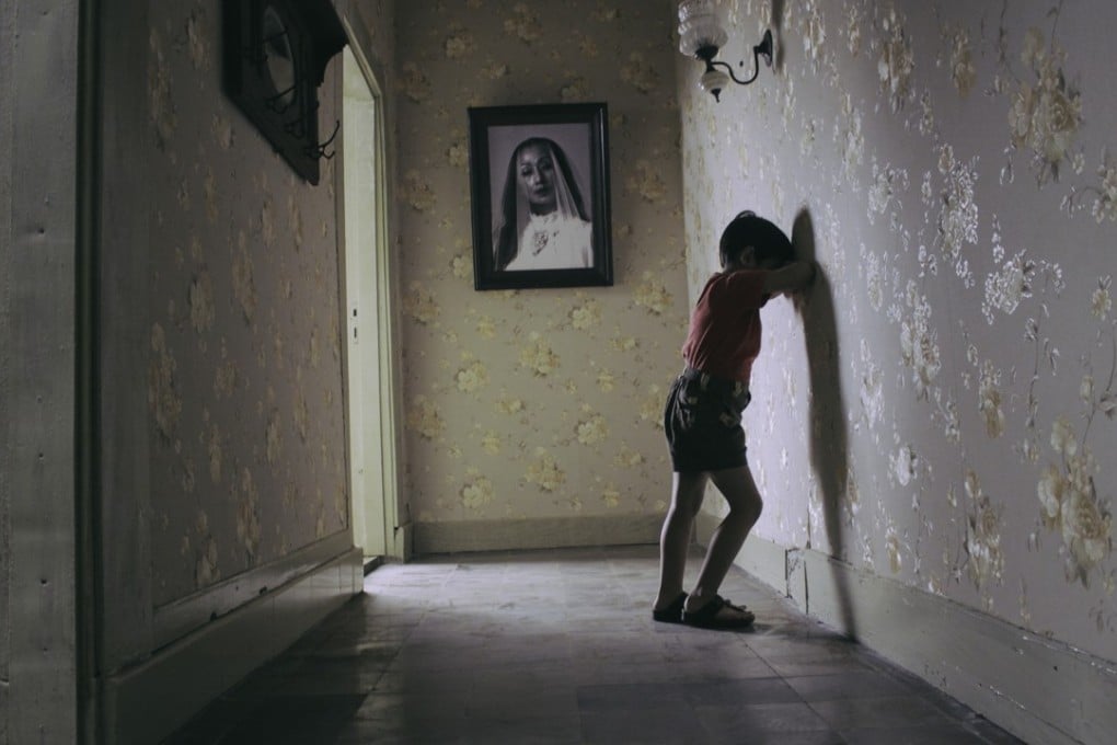 A still from Satan’s Slaves (category IIB, Indonesian), directed by Joko Anwar and starring Ayu Laksmi and Tara Basro.