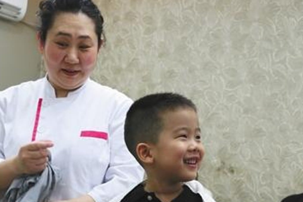 A haircut on the day of the festival is thought to bring good luck. Photo: Beijing News