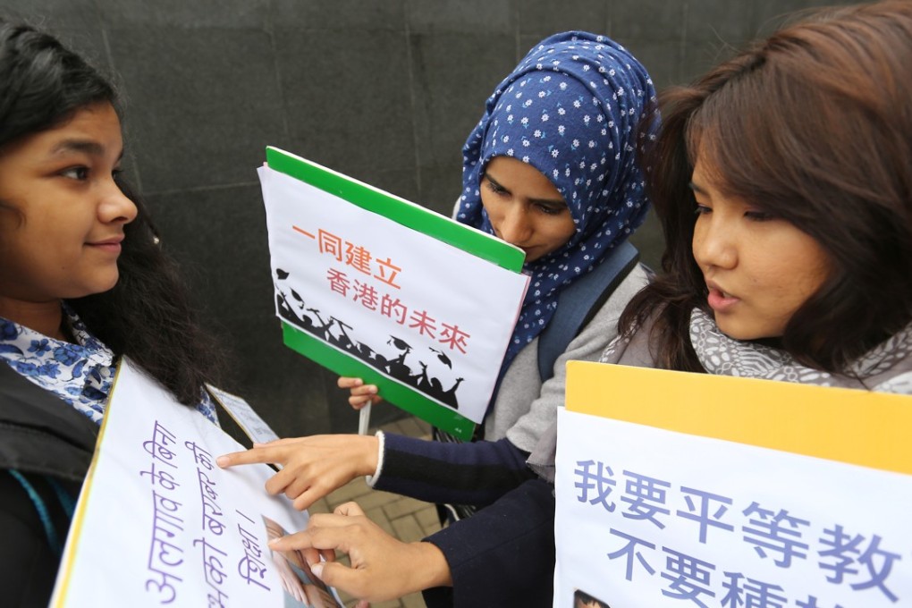 Young women from Hong Kong’s ethnic minority communities check their placards before submitting their wish list for the policy address to then chief executive Leung Chun-ying in 2017. Photo: Xiaomei Chen