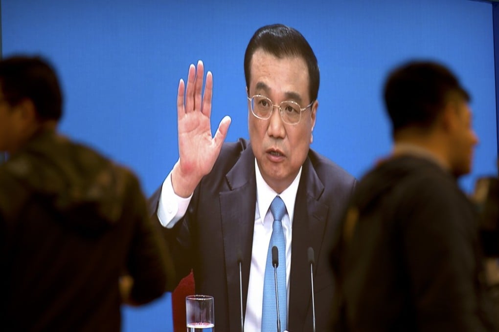 Premier Li Keqiang is shown on a large screen as he speaks during a press conference in Beijing on Tuesday. Photo: AP