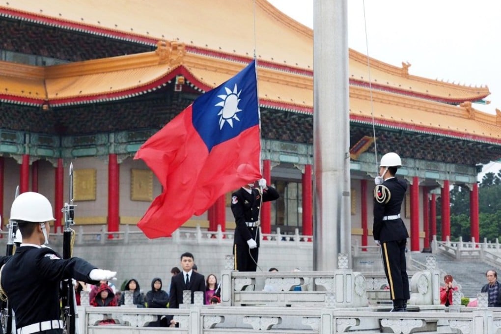 Soldiers lower Taiwan’s national flag at Liberty Square in Taipei, on March 7. Photo: EPA-EFE