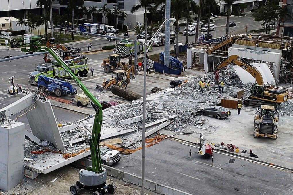 Recovery operations are seen on Saturday at the site of the Florida International University-Sweetwater University bridge, which collapsed last week. Photo: Miami Herald via AP