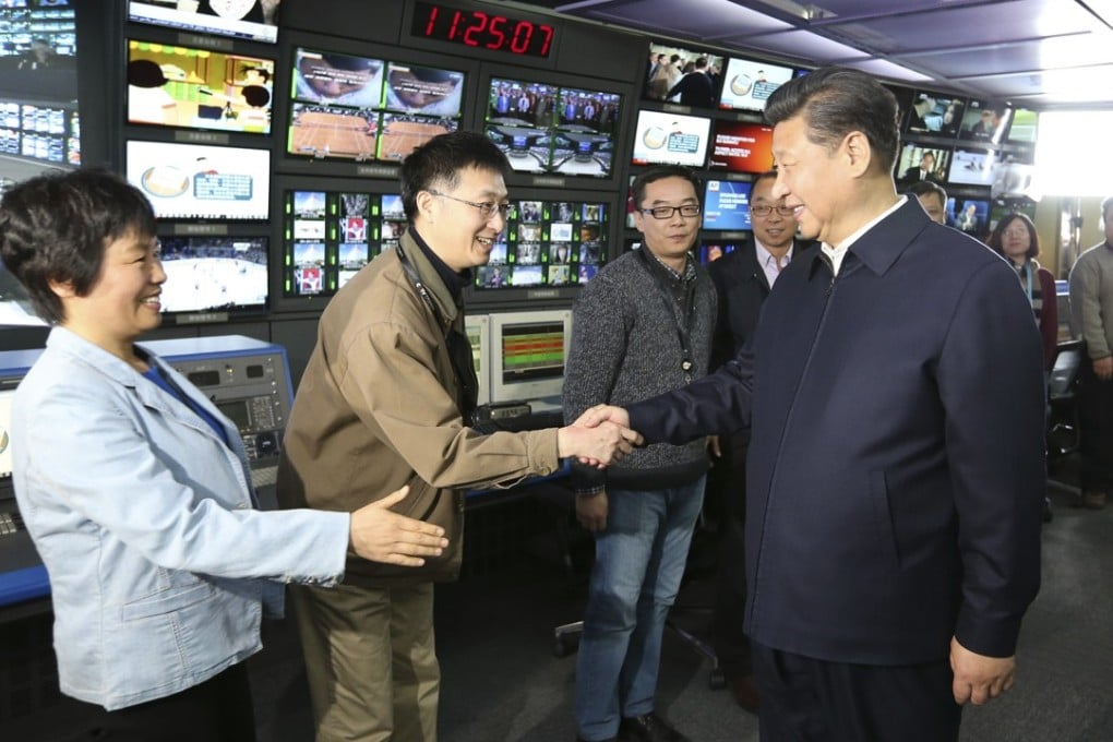 Xi Jinping shakes hands with staff in the control room of China Central Television in Beijing during a high-profile tour of the top three state media outlets in 2016. Photo: Xinhua via AP