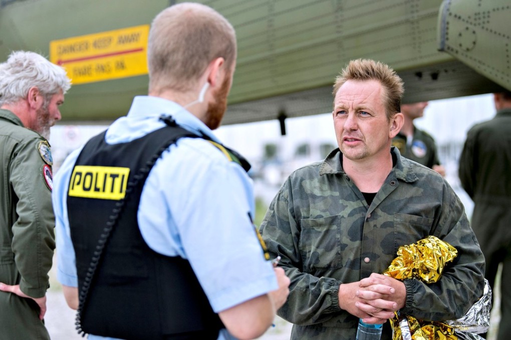 Danish submarine owner and inventor Peter Madsen lands with the help of the Danish defence in Dragor Harbor south of Copenhagen, Denmark August 11, 2017. Scanpix Denmark/Bax Lindhardt/via REUTERS ATTENTION EDITORS – THIS IMAGE WAS PROVIDED BY A THIRD PARTY. DENMARK OUT. NO COMMERCIAL OR EDITORIAL SALES IN DENMARK.