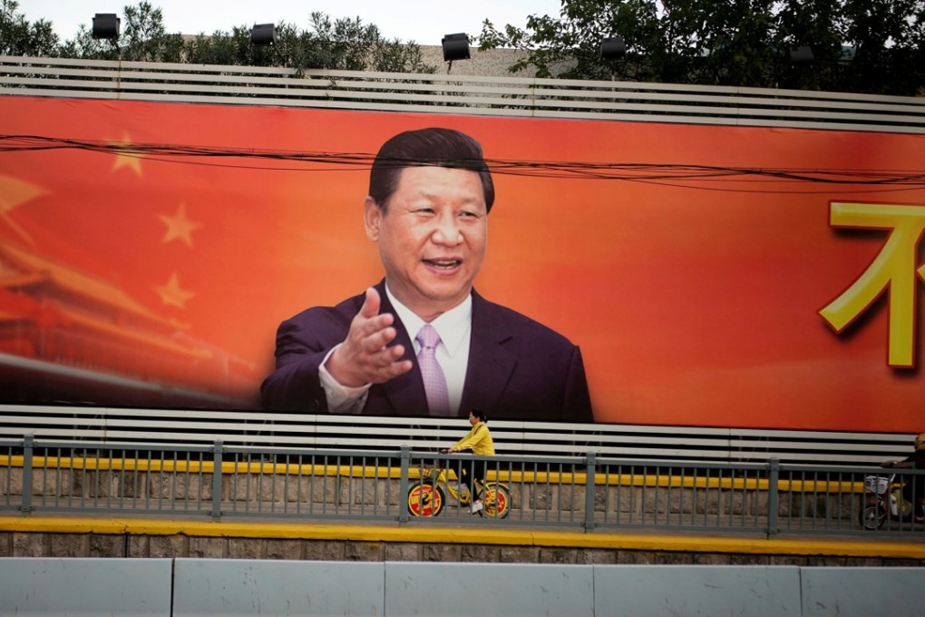 A poster with a portrait of Chinese President Xi Jinping is displayed along a street in Shanghai on October 24, 2017. Photo: REUTERS/Aly Song/File Photo
