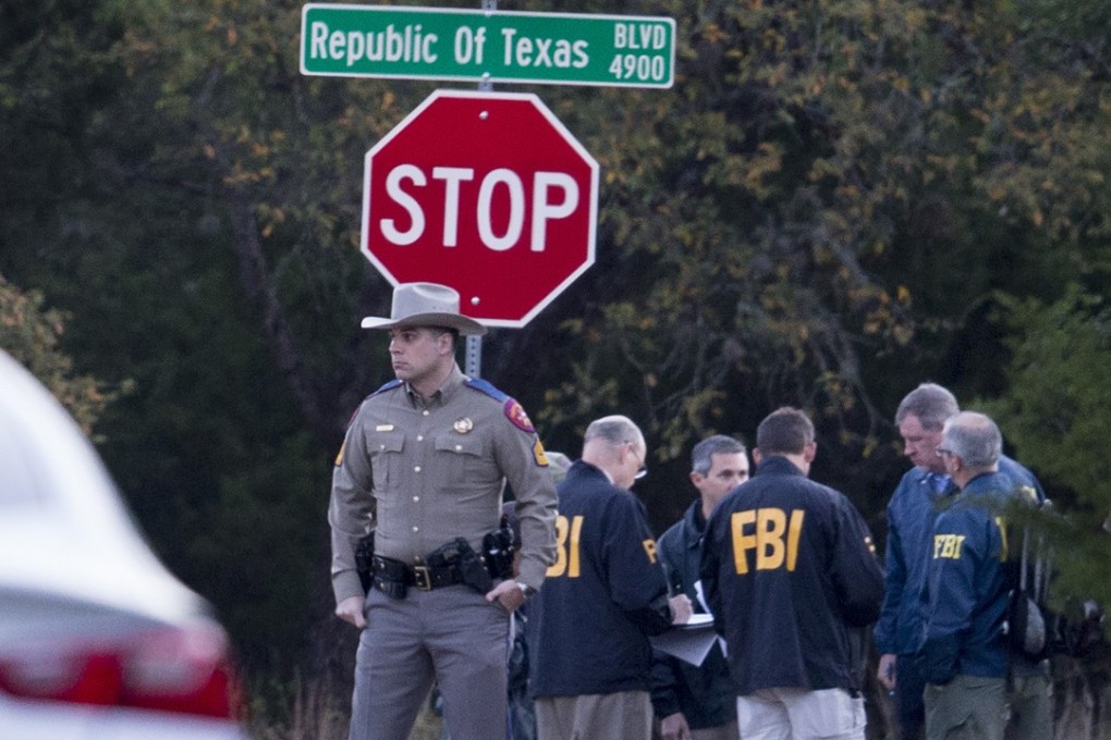 Law enforcement officers investigate the latest bombing on Monday. Photo: TNS