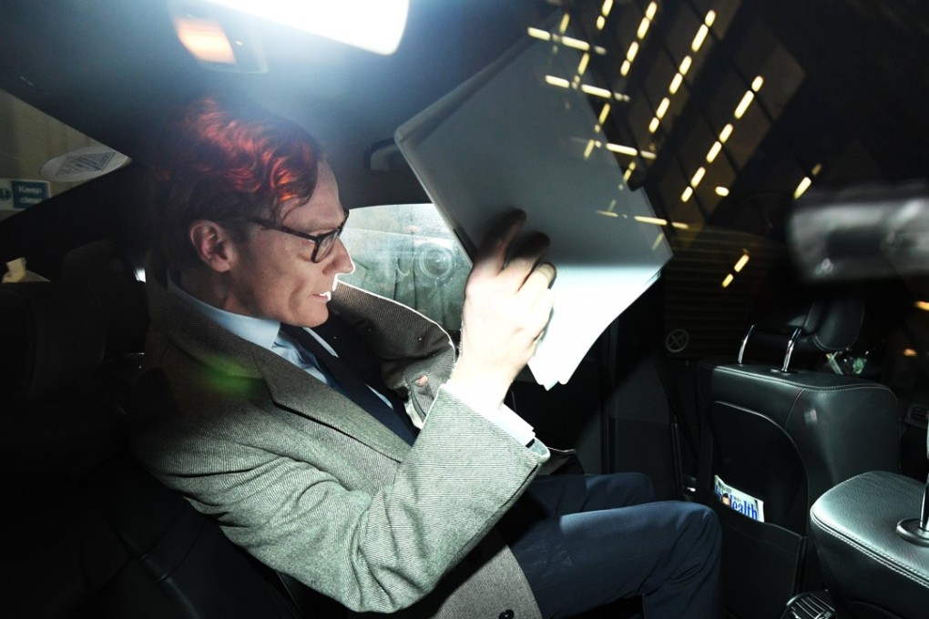 Alexander Nix, CEO of the London-based political consulting firm Cambridge Analytica leaves his offices through the back door in London on Tuesday. Photo: EPA