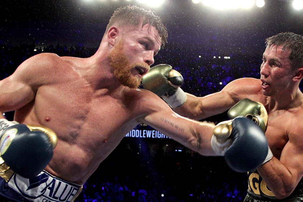 Gennady Golovkin (right) exchanges blows with Canelo Alvarez during their WBC, WBA and IBF middleweight championship fight at the T-Mobile Arena on September 16, 2017 in Las Vegas, Nevada. Gennady Golovkin retained his three world middleweight titles, fighting to a draw with Mexican star Canelo Alvarez in a showdown for middleweight supremacy that lived up the hype. Photo: AFP