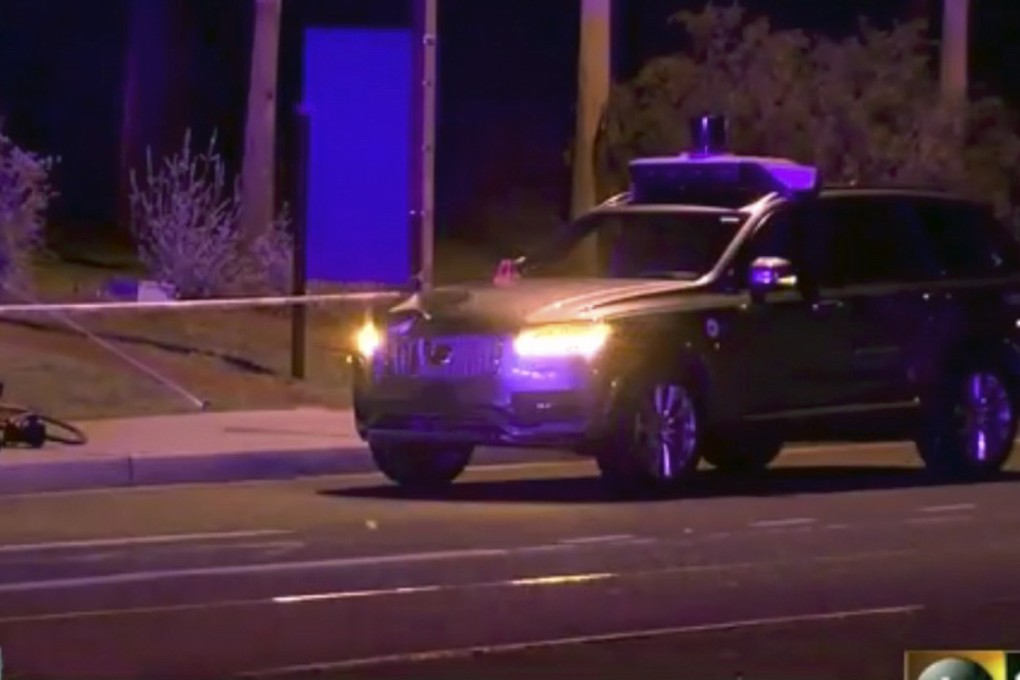 This March 19, 2018 still image taken from video provided by ABC-15 in Arizona shows investigators at the scene of a fatal accident involving a self driving Uber car on the street in Tempe. Police in the city of Tempe said on March 19, 2018, that the vehicle was in autonomous mode with an operator behind the wheel when the woman walking outside a pedestrian crossing was hit. The incident prompted Toyota to suspends its own driverless car programme. Photo: ABC-15.com via AP