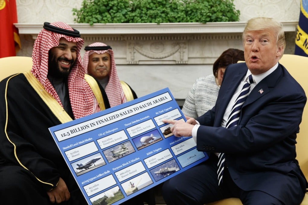 US President Donald Trump shows a chart highlighting arms sales to Saudi Arabia during a meeting with Saudi Crown Prince Mohammed bin Salman in the Oval Office of the White House on Tuesday. Photo: AP