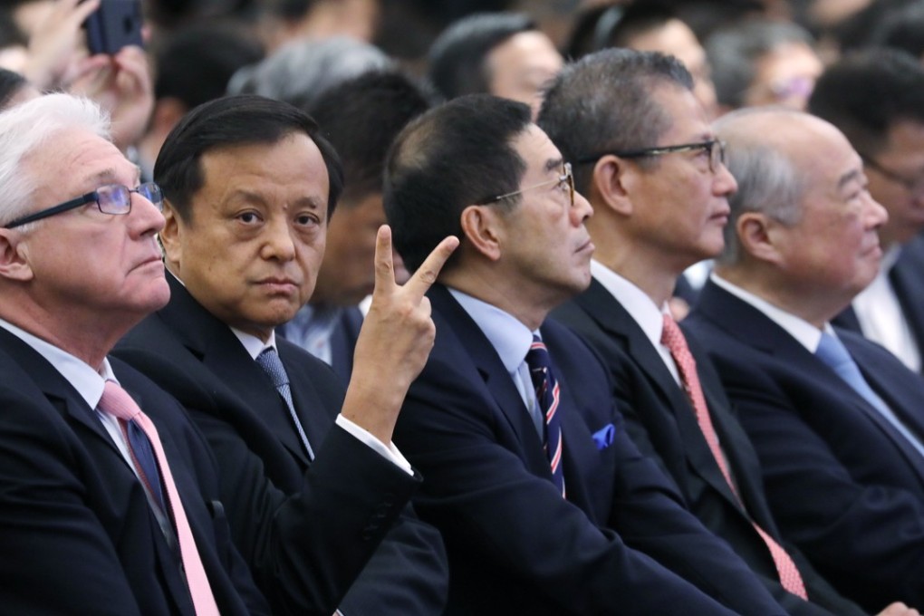 From left: James Greenwood, president and CEO of the Biotechnology Innovation Organisation; Charles Li Xiaojia, chief executive of Hong Kong Exchanges and Clearing; Carlson Tong, chairman of the Securities and Futures Commission; Hong Kong Financial Secretary Paul Chan Mo-po; and Chow Chung-kong, chairman of HKEX, at the HKEX Biotech Summit. Photo: Edward Wong