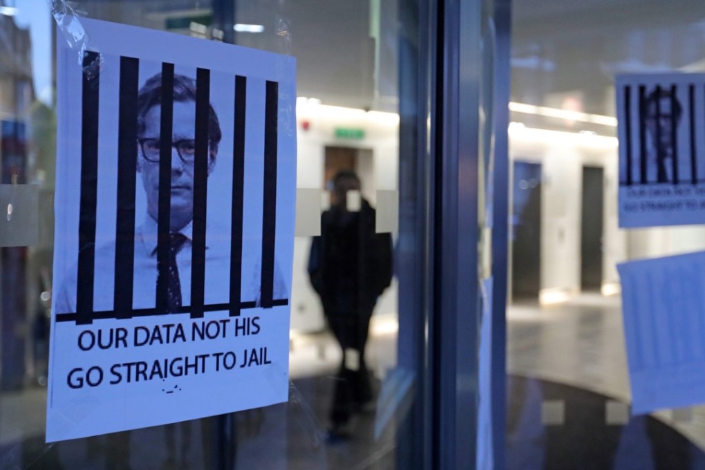 Posters depicting Cambridge Analytica's CEO Alexander Nix behind bars, with the slogan "Our Data Not His. Go Straight To Jail" are pictured at the entrance of the company's offices in central London on March 20, 2018. In the wake of the revelations, Facebook CEO Mark Zuckerberg has proposed fixes to his site’s rules. Photo: AFP