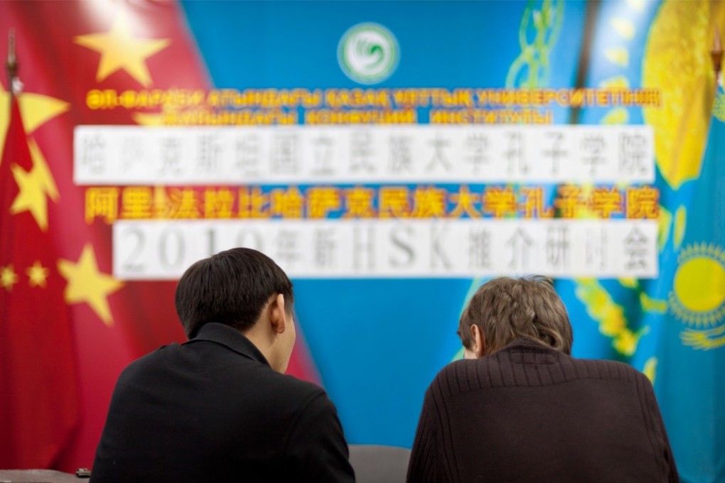 The US operations of China's Confucius Institute would be required to register with the American government as foreign agents under a draft proposal in the US Senate and House of Representatives. Pictured: Kazakh Chinese-speaking students attend the Confucius Institute at Al-Farabi Kazakh National University in Almaty.
