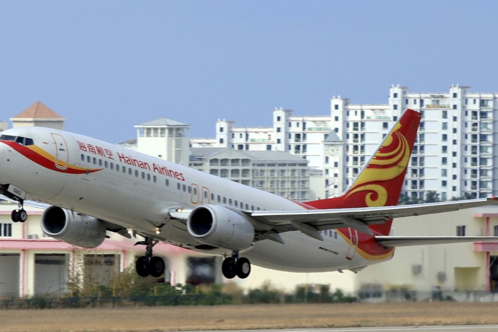 A Hainan Airlines plane takes off from the Sanya Phoenix International Airport in Hainan province. The airline reported a rise in profit for 2017 but faces stiff competition ahead. Photo: Reuters