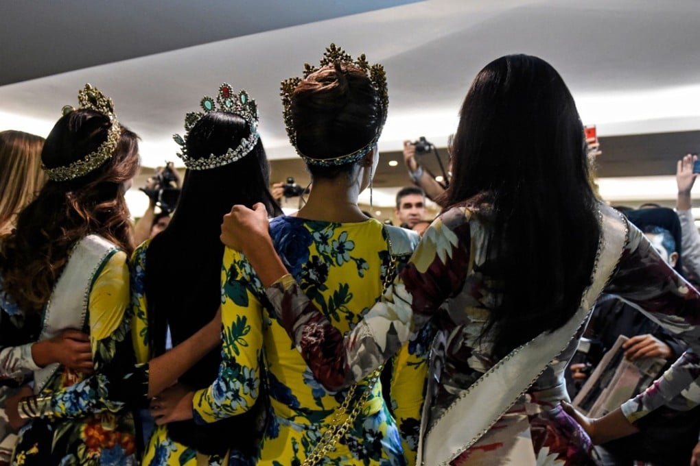 In this file photo taken on November 10, 2017 Miss Venezuela 2017 Sthefany Gutierrez (centre left) poses after a press conference in Caracas. Miss Venezuela, the biggest show in the battered Venezuelan entertainment industry, is under scrutiny after accusations of corruption and sexual favours among former competitors. Photo: Agence France-Presse