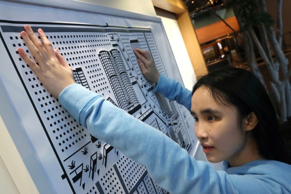 Student Joyce Chan Lok-yee visits Central Beyond Vision exhibition. Photo: K.Y. Cheng