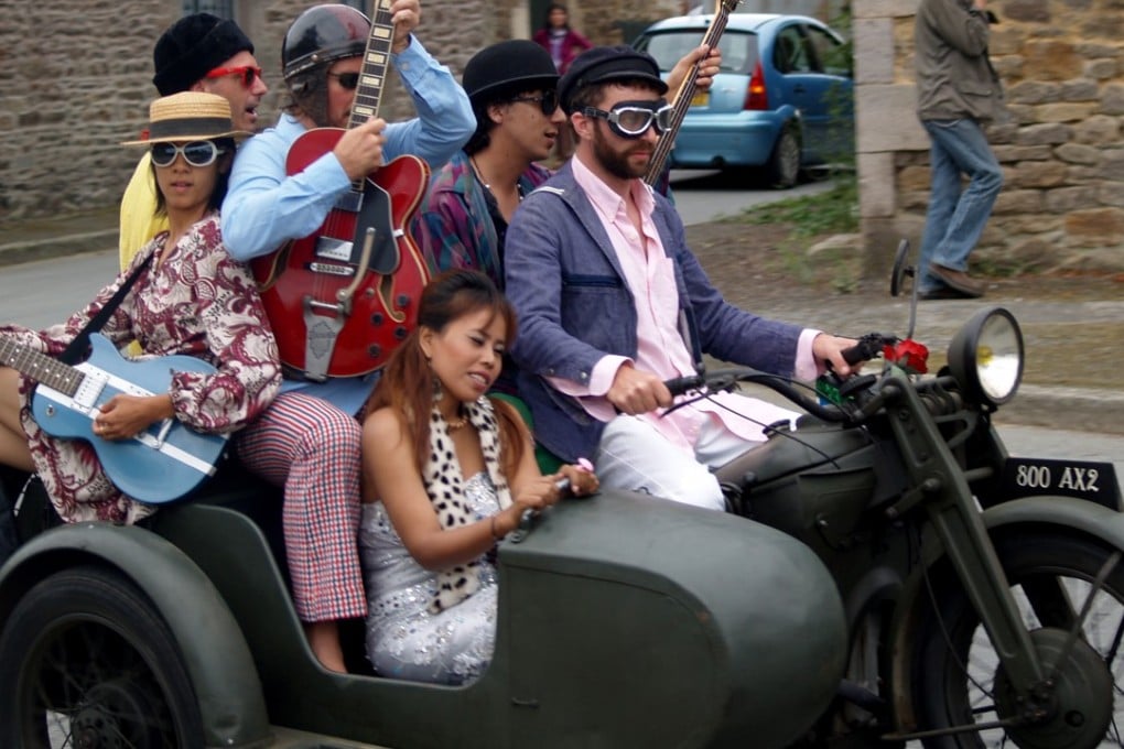 Singer Kak Channthy with members of The Cambodian Space Project.