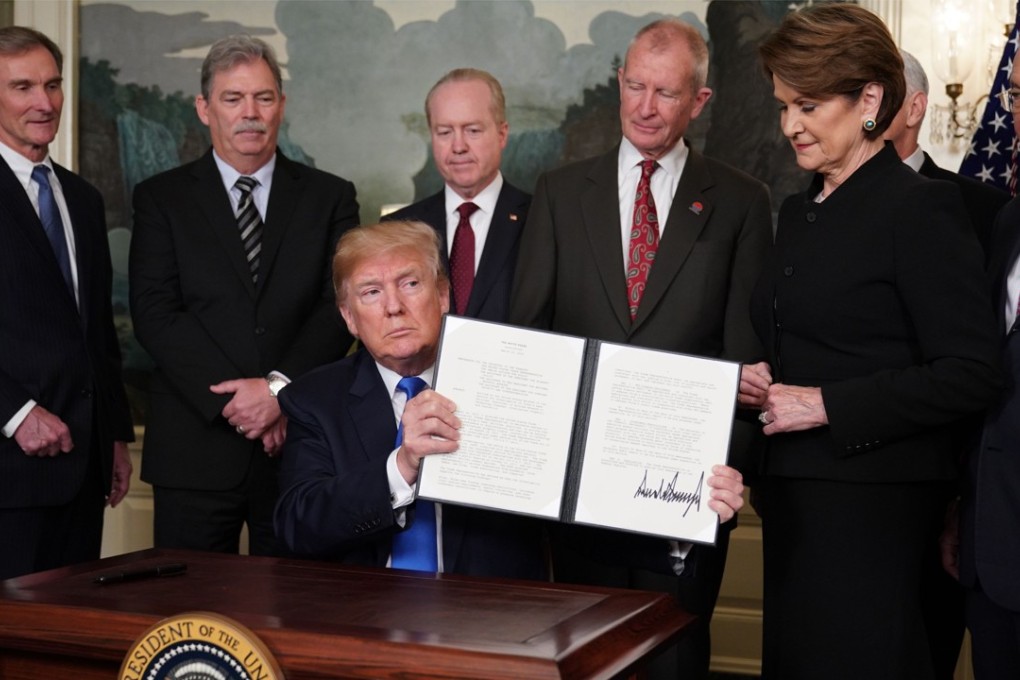 US President Donald Trump’s signing of trade sanctions against China threaten to spark a disruption in the world’s largest economic relationship, pegged at about US$650 billion in goods and services trade in 2016. Photo: AFP