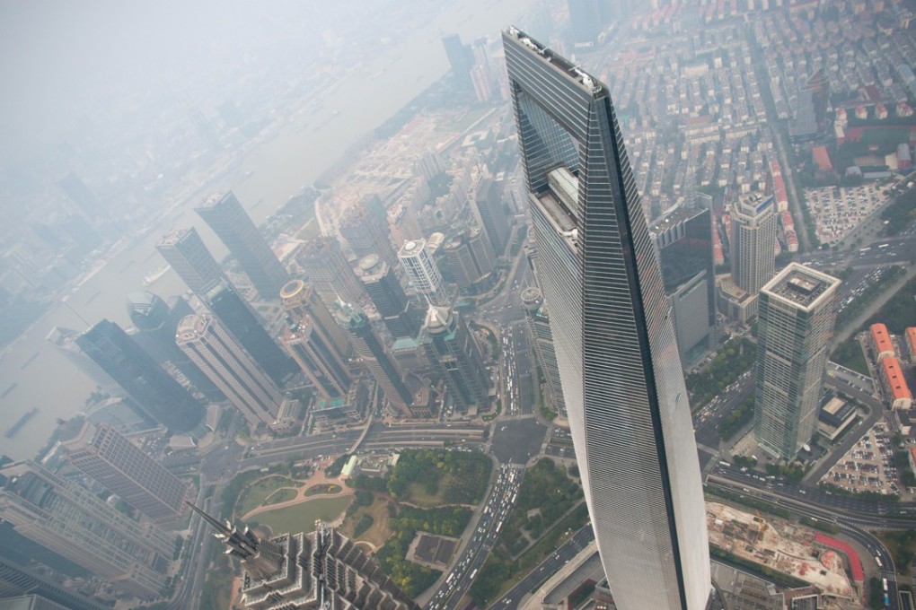 A general view shows the Shanghai World Financial Center and the skyline of the Lujiazui Financial District in Pudong, seen from the 109th floor of the Shanghai Tower. Photo: AFP