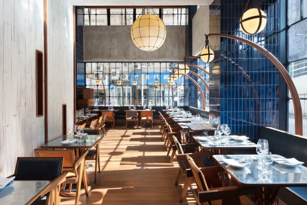 Osteria Marzia at The Fleming Hong Kong has big wrought-iron windows and high ceilings.