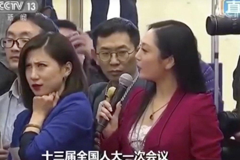 Liang Xiangyi, a reporter for China Business News, gives an epic eye-roll as fellow journalist Zhang Huijun asks a tedious question to a government minister. Photo: CCTV