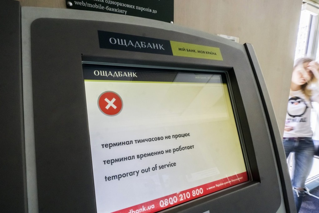 An “out of service” notice is displayed on the screen of an ATM at a bank infected by the Petya ransomware computer virus in Kiev in late June. The cyberattack, similar to WannaCry, began in Ukraine, infecting computer networks and demanding US$300 in cryptocurrency to unlock their systems before spreading to different parts of the world. Photo: Bloomberg