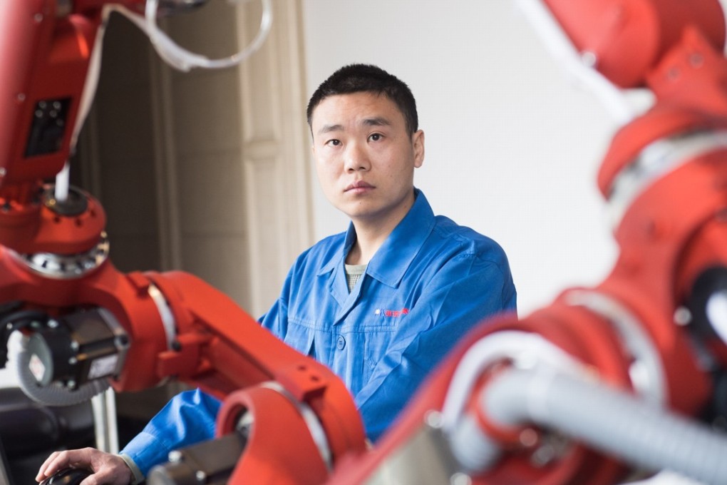 A technician debugs a robot in Rui'an City, east of China's Zhejiang province in January this year. The government’s “Made in China 2025” strategy for industrial modernisation aims to support the country’s transformation from a manufacturing hub into one of next-generation technological breakthroughs. Photo: Xinhua