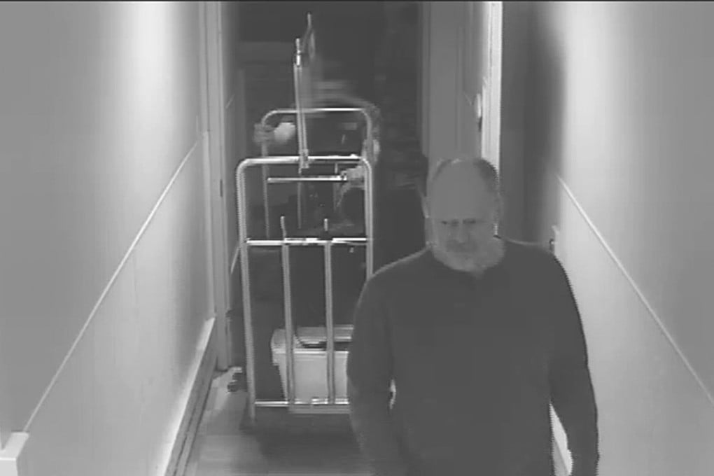 In this September28, 2017, security camera image released by MGM Resorts, Stephen Paddock is followed by a bellman in a hallway, at the Mandalay Bay hotel in Las Vegas. Photo: AP