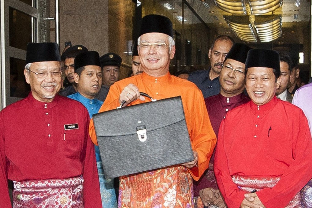 Malaysian PM Najib Razak with his budget briefcase. Photo: AFP