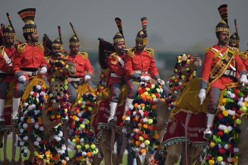 A Pakistani camel-mounted military band performs during a Pakistan Day military parade in Islamabad on Friday. Pakistan National Day commemorates the passing of the Lahore Resolution, when a separate nation for the Muslims of The British Indian Empire was demanded on March 23, 1940. Photo: AFP