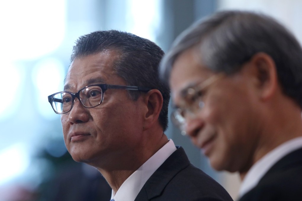 Finance chief Paul Chan (left) and Welfare chief Law Chi-kwong, at the announcement of cash handouts for 2.8 million Hongkongers. Photo: Sam Tsang