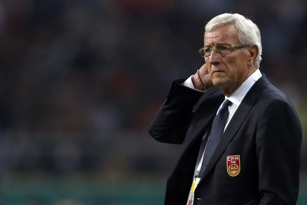 China boss Marcello Lippi watches as Wales romp to a 6-0 victory against his side. Photo: AP
