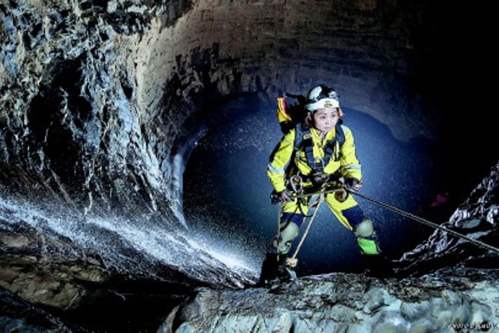 A member of the research team abseils down a massive shaft at the Shuanghe Cave network in Zunyi, in southern China’s Guizhou province. Photo: People.cn