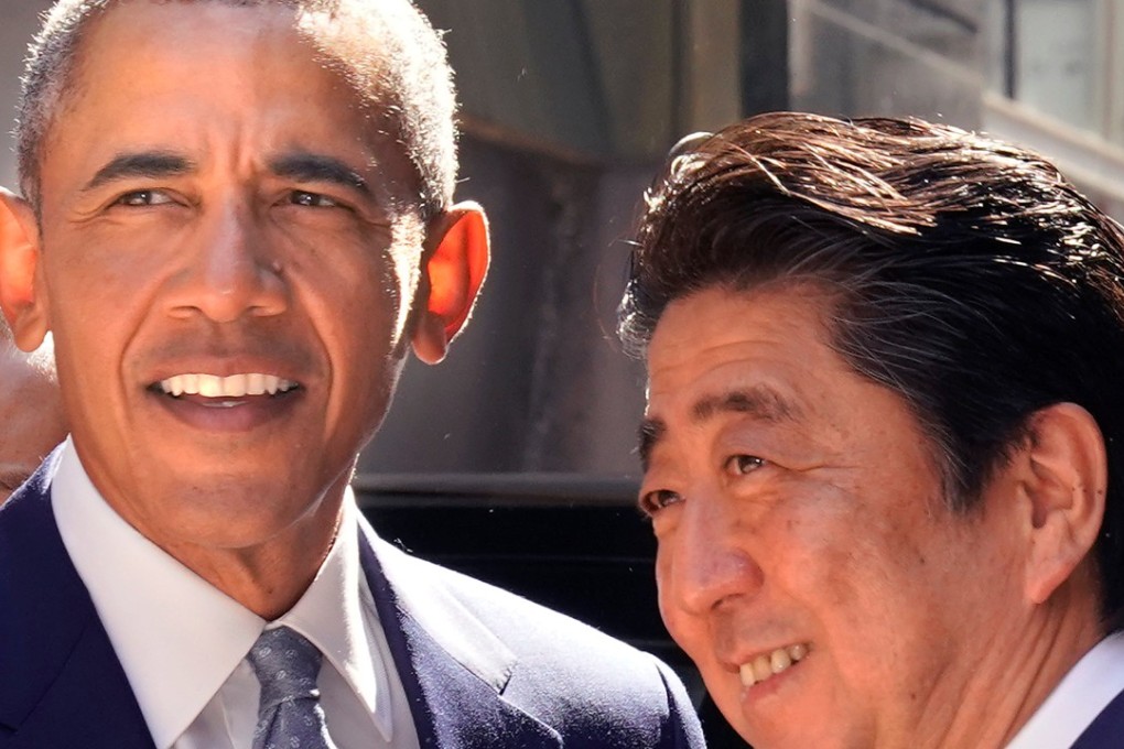 Former US President Barack Obama is greeted by Japanese Prime Minister Shinzo Abe during his visit to Japan. Photo: Reuters