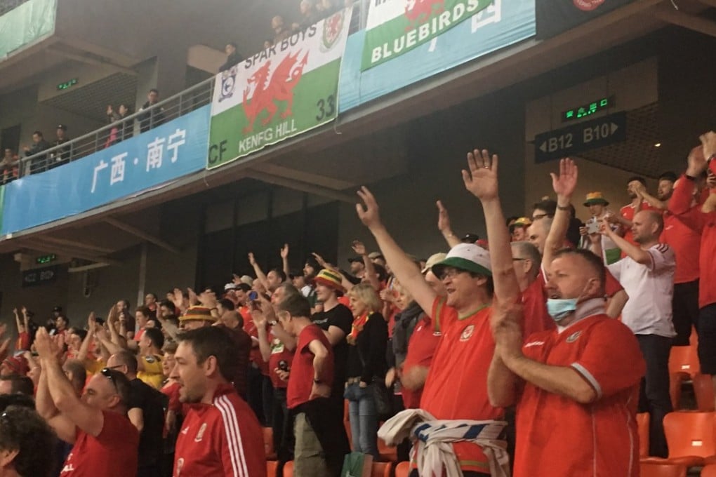 Wales fans cheer on their team against China. Photo: Jonathan White