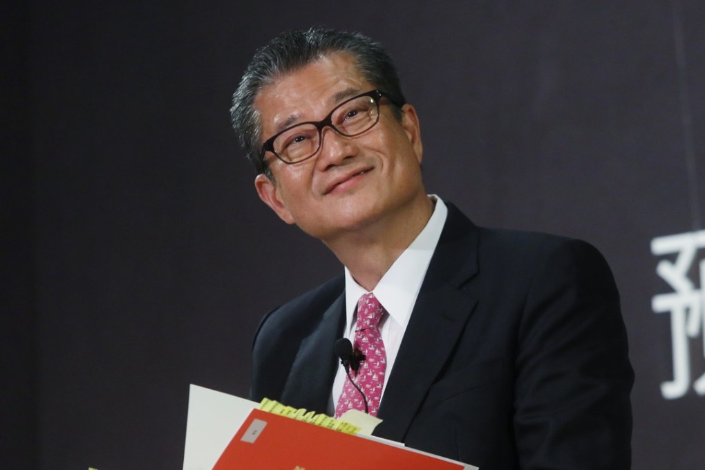 Financial Secretary Paul Chan announces the handout on Friday. Photo: Sam Tsang