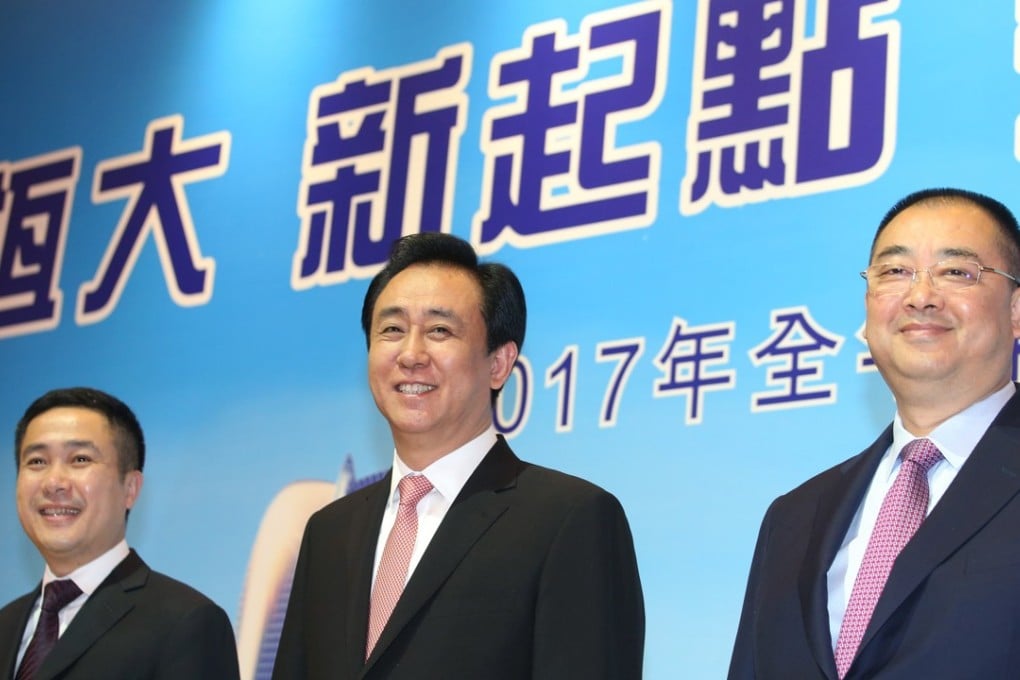 From left, Pan Darong, the executive director and CFO of China Evergrande Group, Hui Ka-yan, Evergrande’s chairman, and Xia Haijun, the company’s vice-chairman and CEO, during the release of the developer’s annual result in Hong Kong on Monday. Photo: David Wong