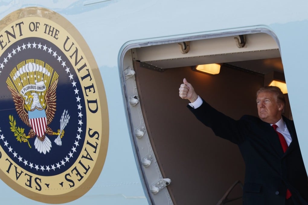 US President Donald Trump boards Air Force One, which displays the presidential seal, for a trip to California on March 13. Photo: AP