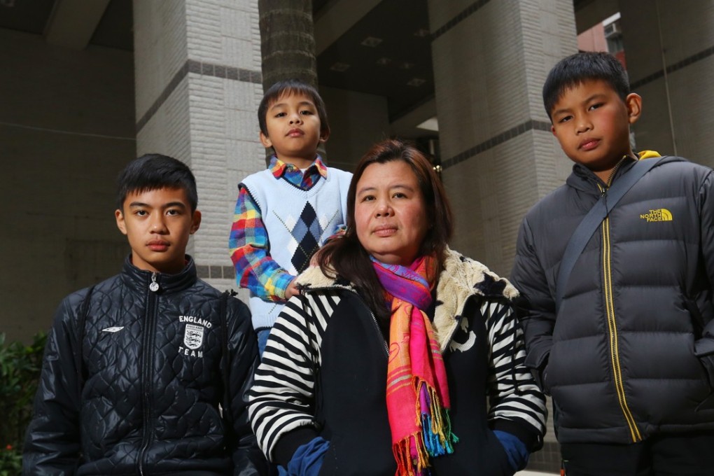 Desiree Rante Luis (centre), who may be separated from her sons (from left) David John, Mark Joelery and Carl Benz. Photo: Edmond So