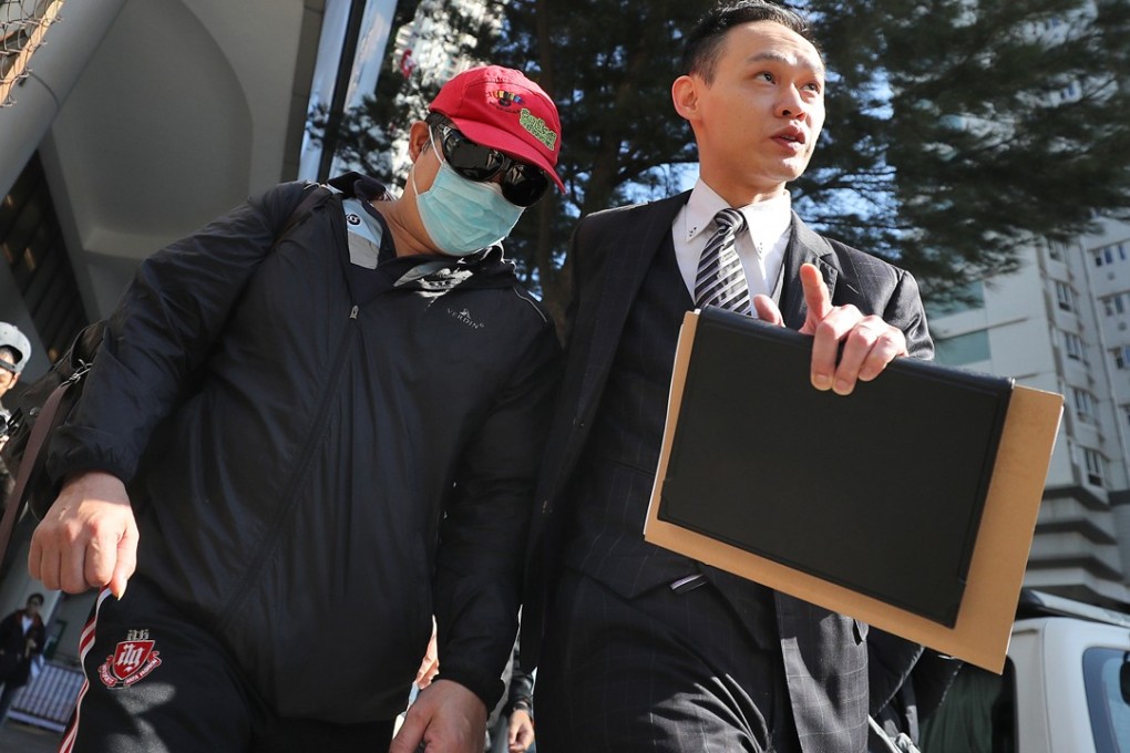 Cheung Kin-wah (left) leaves a Hong Kong court in December last year. Photo: Winson Wong