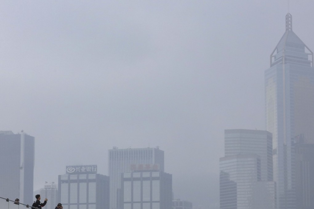 The Center, right, in Hong Kong’s downtown Central district, has 1.2 million square feet of office space, 13,000 square feet of retail space and 402 car parking lots. Photo: Felix Wong