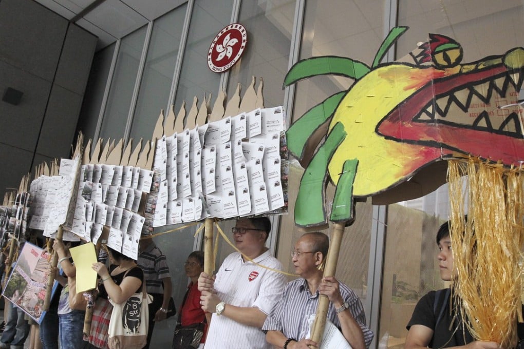 Common sense tells us that a substantial fraction of owners and tenants in public housing flats would be keen to rent out part or all of their flats, writes Richard Wong. Protesters hold up a dragon with protest signs urging more affordable housing at a rally outside the Central Government Offices in Tamar in September 2013.