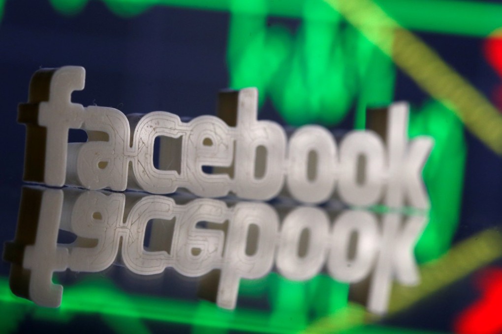 A 3D-printed Facebook logo is seen in front of a stock graph in this illustration photo on March 20, 2018. Facebook’s stock has been hit by a privacy scandal, but most analysts still project the stock as a buy. Photo: Reuters