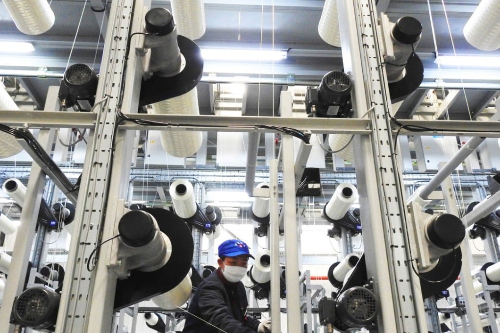 A file picture of a worker on a carbon fibre production line in Lianyungang in Jiangsu province. Photo: Agence France-Presse