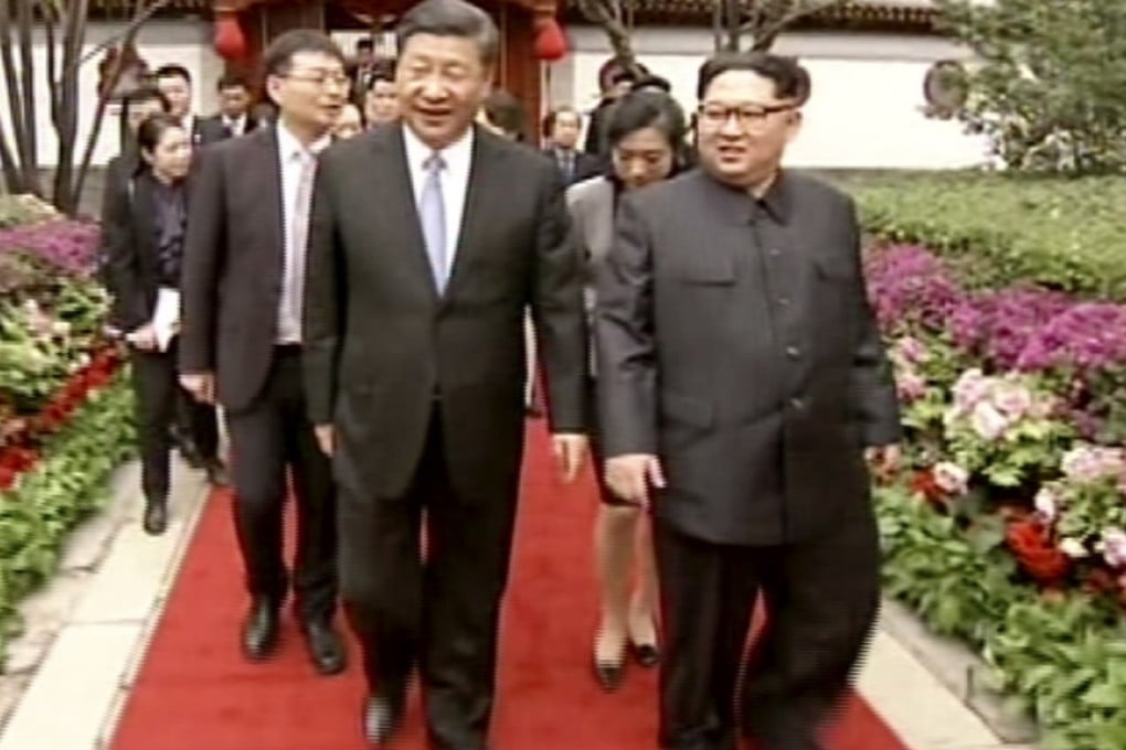 In this image taken from CCTV video footage, North Korean leader Kim Jong-un (right) and Chinese President Xi Jinping meet in Beijing this week. Photo: CCTV via AP Video