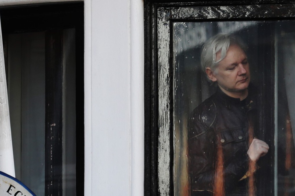 Julian Assange is seen inside the Ecuadorean embassy in London, where he has been confined for most of the past six years. Photo: Bloomberg