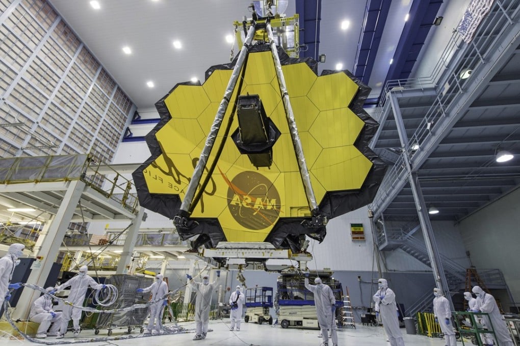 In this April 13, 2017 photo provided by Nasa, technicians lift the mirror of the James Webb Space Telescope using a crane at the Goddard Space Flight Centre in Greenbelt, Maryland. Photo: AP
