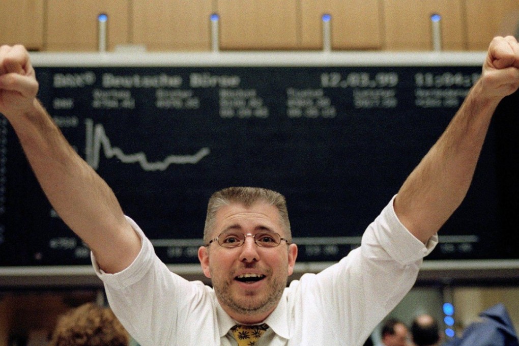 A German equities trader celebrating on March 12, 1999 after the market rose 5 per cent. Since 1900 no other investment class has consistently outperformed. Photo: AFP