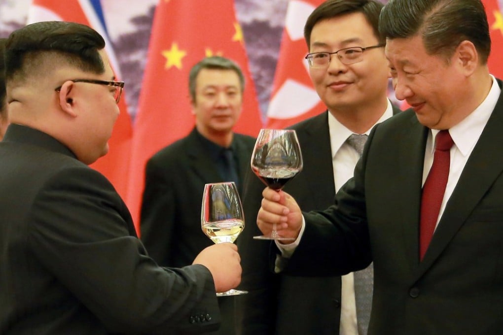 North Korean leader Kim Jong-un toasts with Chinese President Xi Jinping during his first to China. Photo: Reuters/KCNA