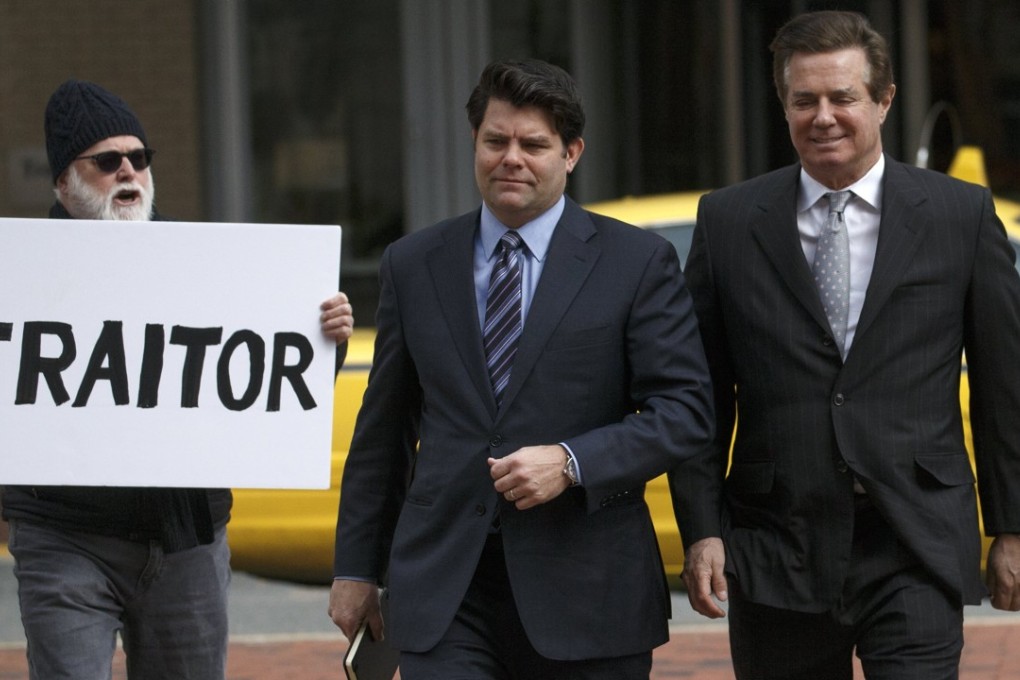 Former Trump Campaign Manager Paul Manafort (right) arrives for arraignment in his tax evasion and bank fraud trial on March 8. Manafort has pleaded not guilty. It emerged Wednesday that John Dowd, Donald Trump’s lawyer, may have suggested pardoning Manafort. Photo: EPA-EFE